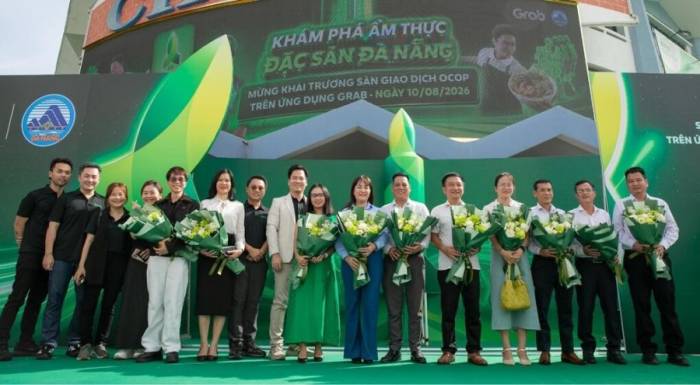 Các đại biểu tham dự lễ khai trương sàn giao dịch OCOP - Đặc sản Đà Nẵng trên ứng dụng Grab, tại Đà Nẵng, ngày 10/8. Ảnh: Quỳnh Như