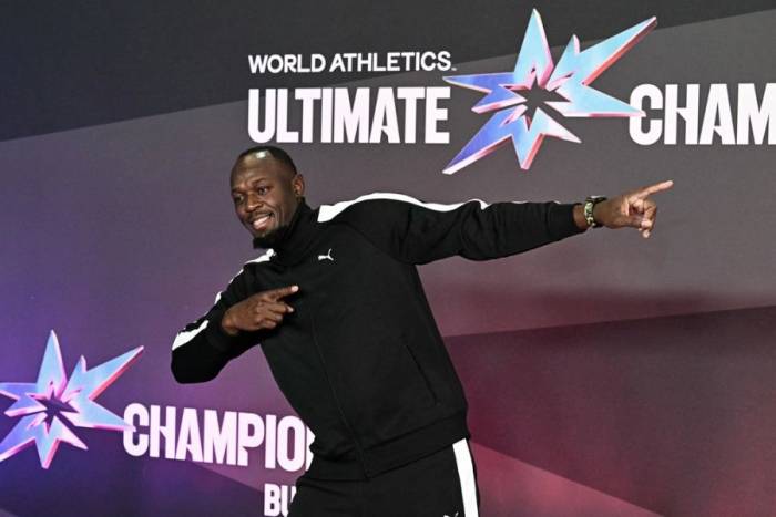 Usain Bolt tạo dáng khi tham dự sự kiện thảm đỏ trước Ultimate Championship tại Trung tâm điền kinh quốc gia Gyula Zsivotzky, Budapest, Hungary ngày 10/9/2026. Ảnh: AFP