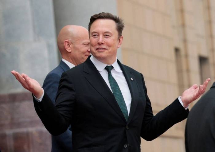 Elon Musk trong chuyến thăm của Tổng thống Mỹ Donald Trump đến Trung Quốc tháng 5. Ảnh: Reuters